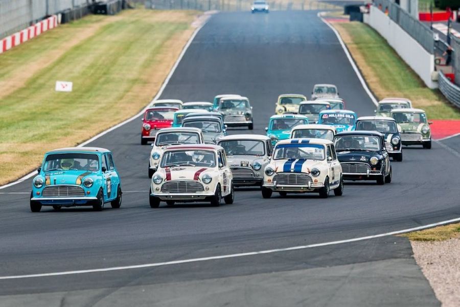 A group of classic Minis on track